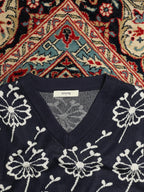 Among printed sleeveless sweater