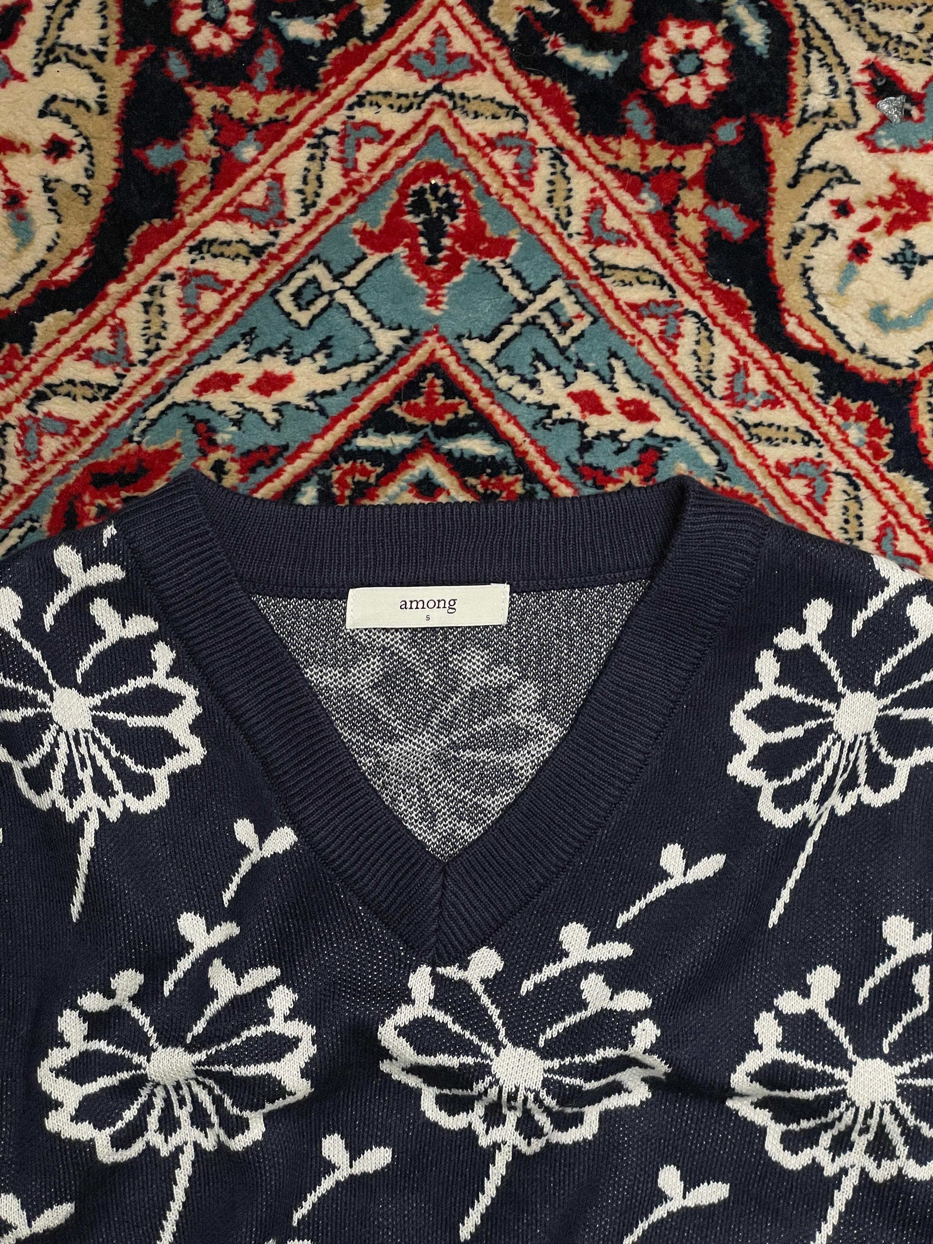 Among printed sleeveless sweater