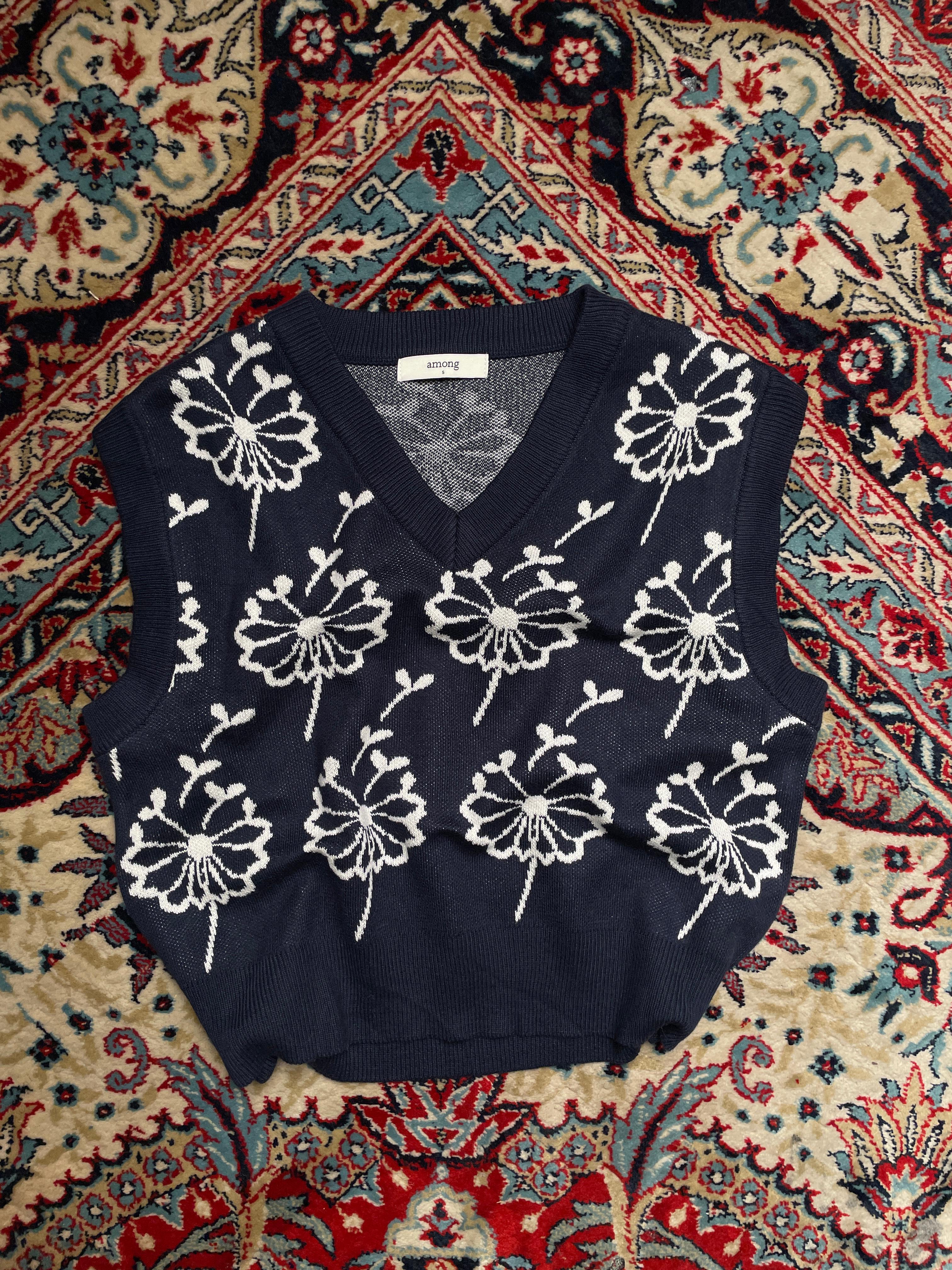 Among printed sleeveless sweater