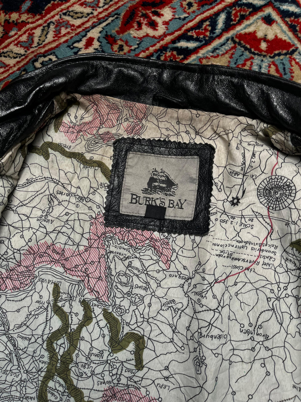 Burk’s Bay Black Leather Bomber Jacket with Map-Print Lining