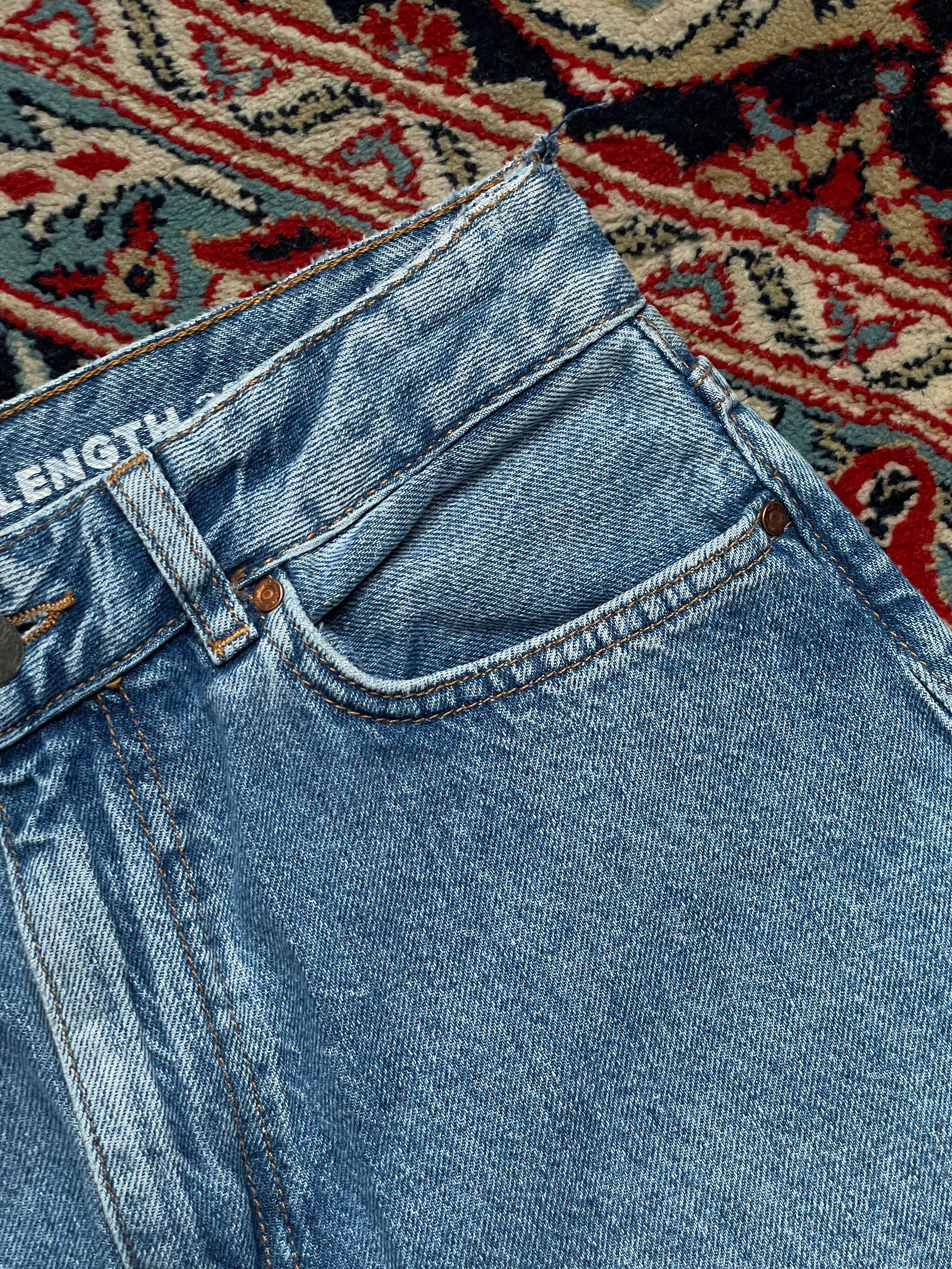 NEVER DENIM LIGHT WASH HIGH WAIST JEANS