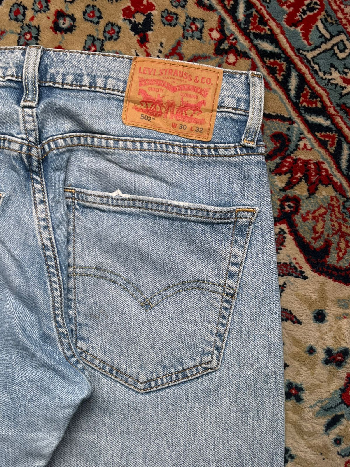 LEVI'S 502 REGULAR TAPER WATERLESS LIGHT WASH JEANS - 30