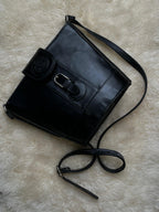 Vintage 90s Bagatique Black Structured Bucket Crossbody Bag Crest Buckle Flap