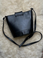 Vintage 90s Bagatique Black Structured Bucket Crossbody Bag Crest Buckle Flap